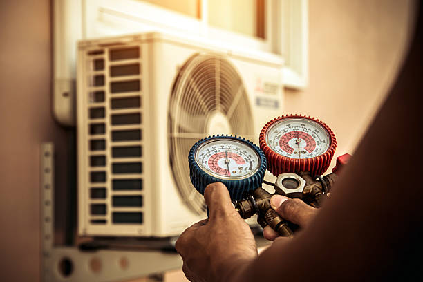 Professional Air Conditioning Service technician working in Kemblesville, PA